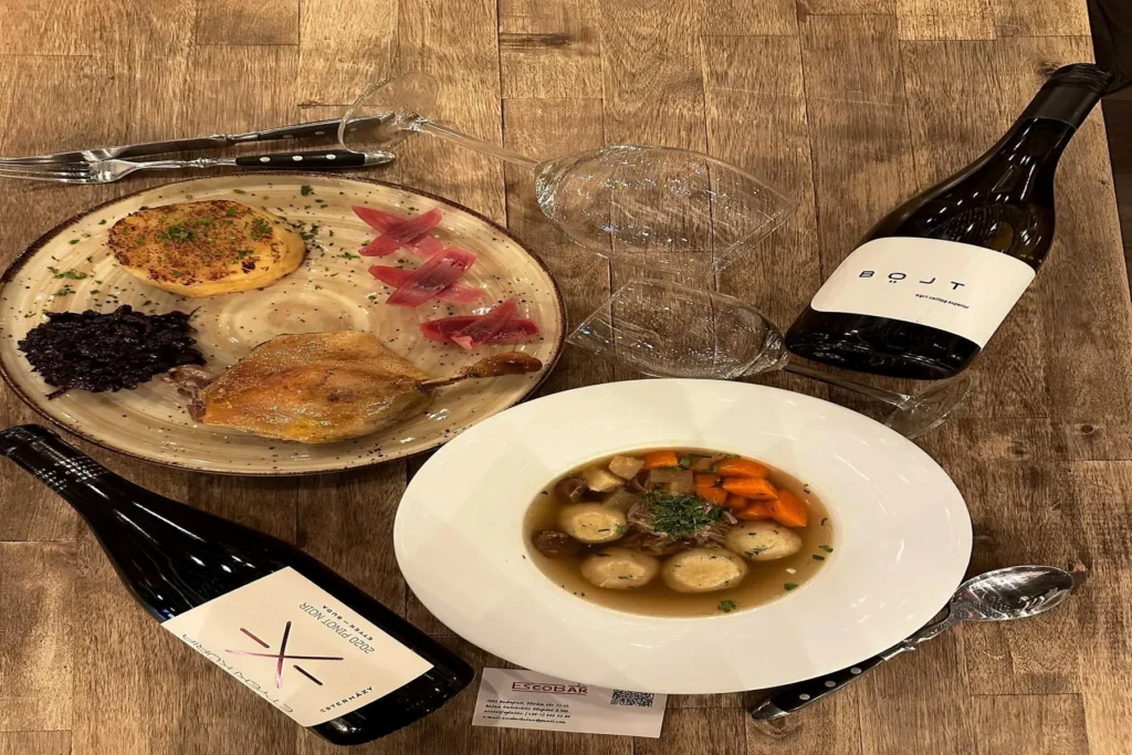 Traditional Hungarian dishes served with wine at Escobar Bálna restaurant