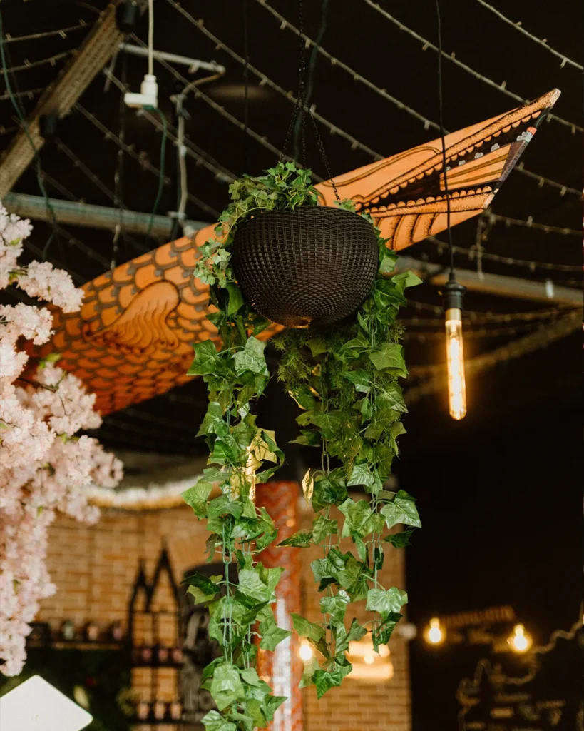Hanging decor and warm lights inside the venue, detailed atmosphere close-up